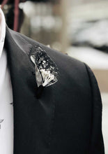Load image into Gallery viewer, Black lace and pearl center lapel pin on model with black blazer.