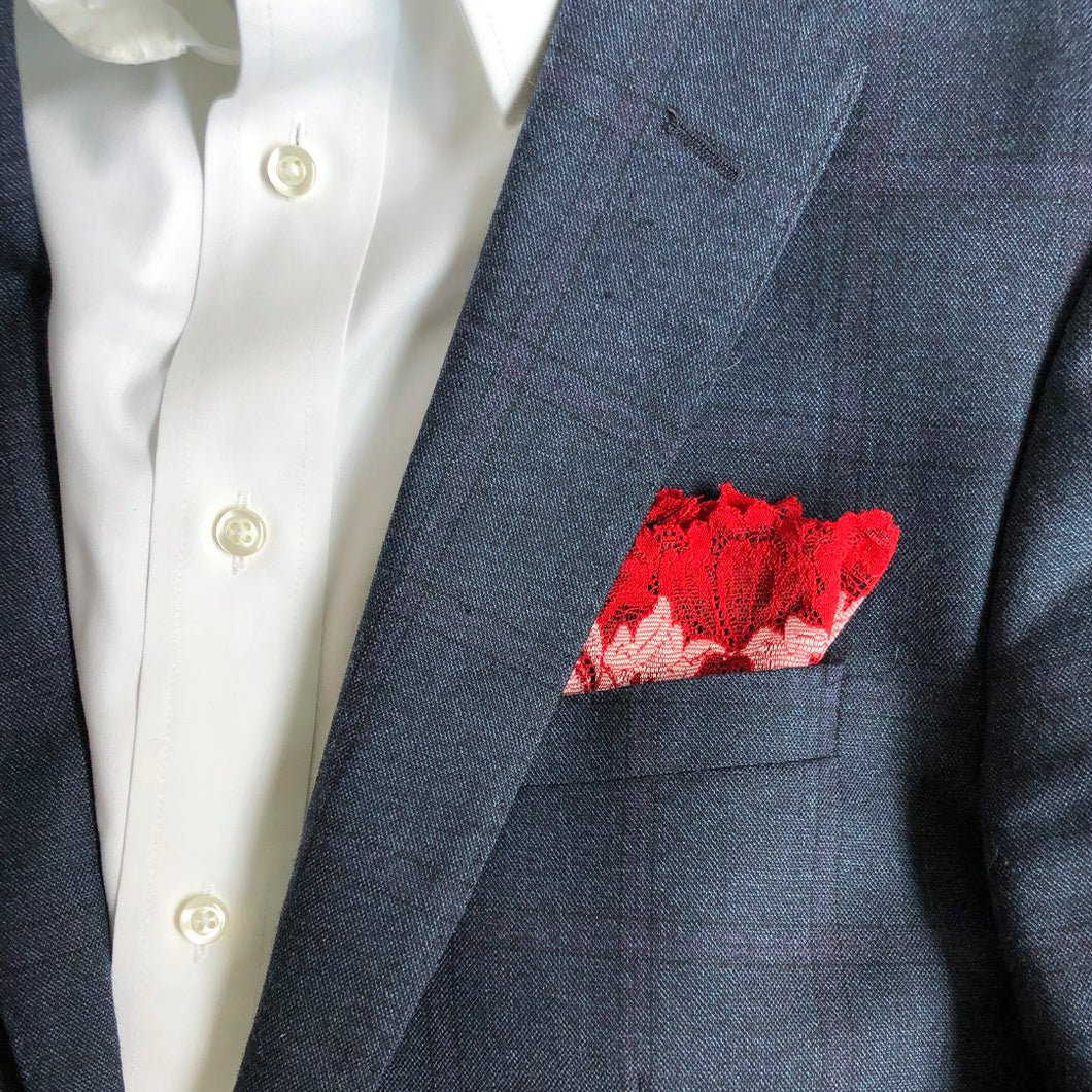 Mezzanotte pocket square in Passion Red folded into lapel pocket.